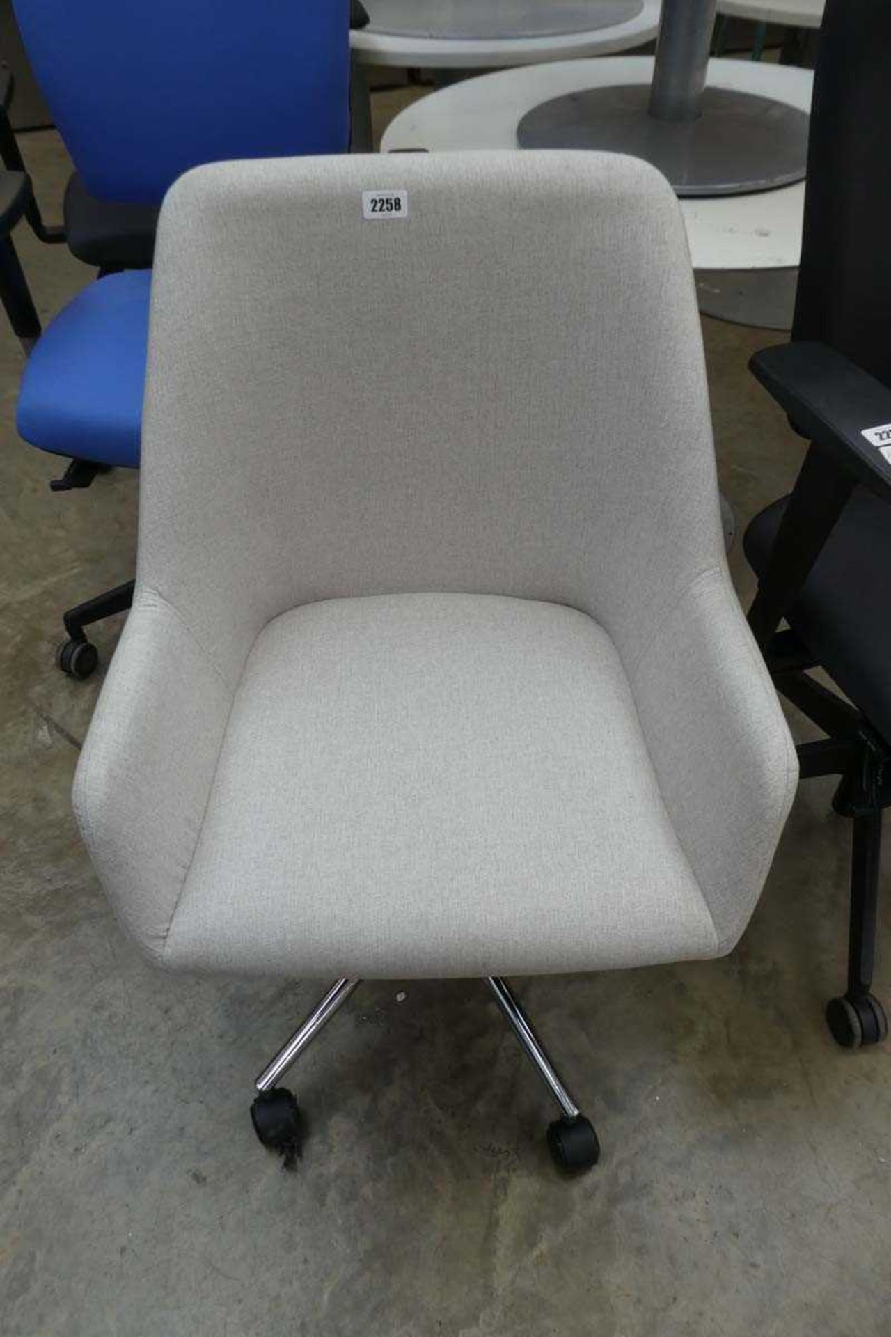 Light grey cloth swivel office armchair on 5 star base