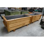 Pair of large wooden planters