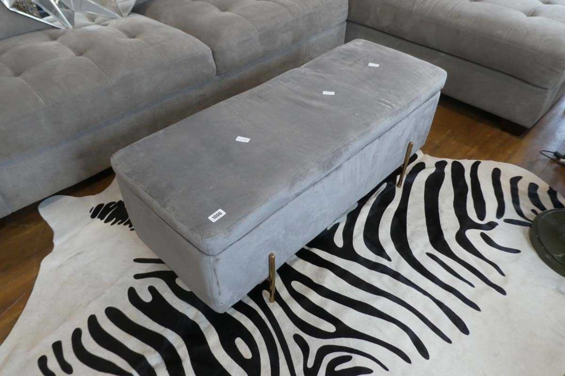 Modern grey upholstered storage ottoman