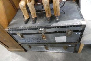 2 twin handled grey packing trunks