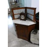 Mahogany single door corner washstand with tiled splash and marble surface