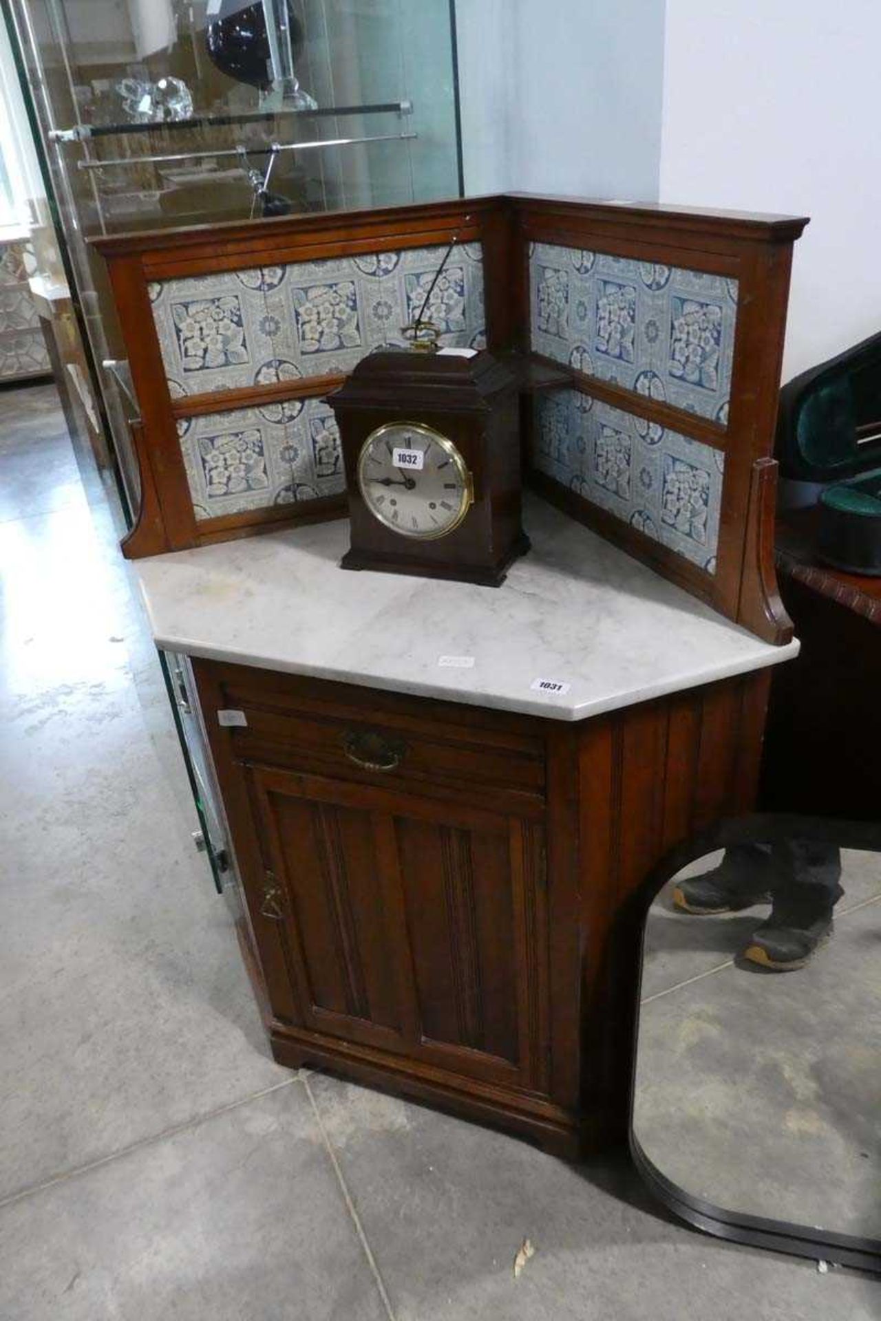 Mahogany single door corner washstand with tiled splash and marble surface