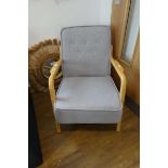 Modern grey upholstered Skandi style armchair on ash wood frame