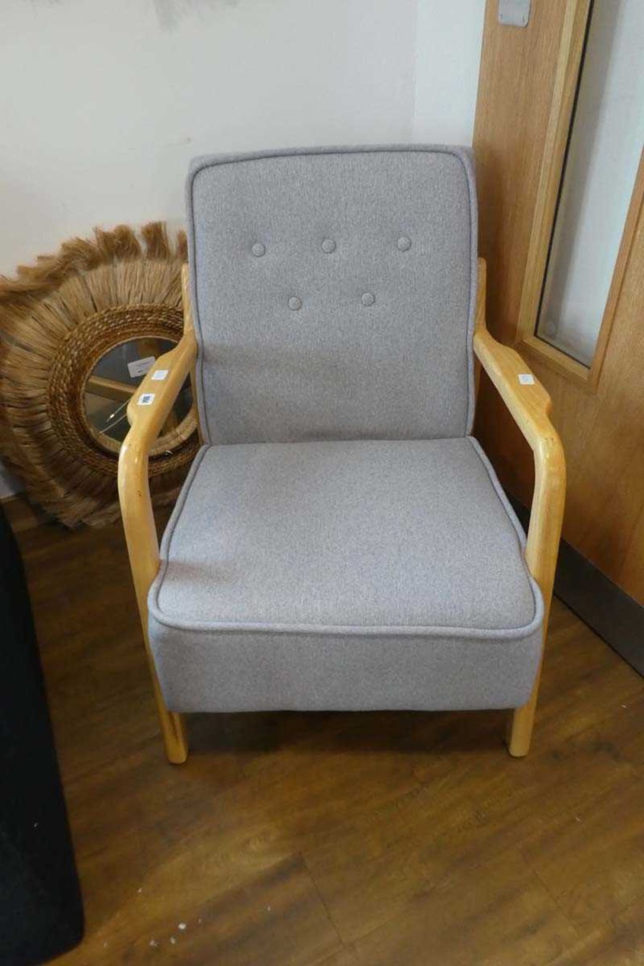 Modern grey upholstered Skandi style armchair on ash wood frame