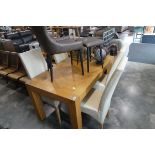 Substantial light oak rectangular dining table and 4 cream leatherette upholstered high back