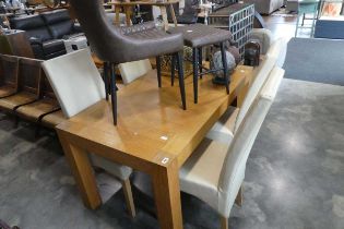 Substantial light oak rectangular dining table and 4 cream leatherette upholstered high back