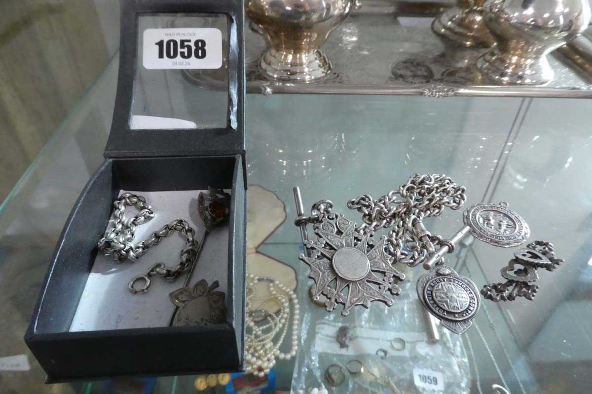 Small box of assorted silver items including hall marked silver cross on chain with a further silver