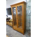 Modern light oak display cabinet with lower drawer