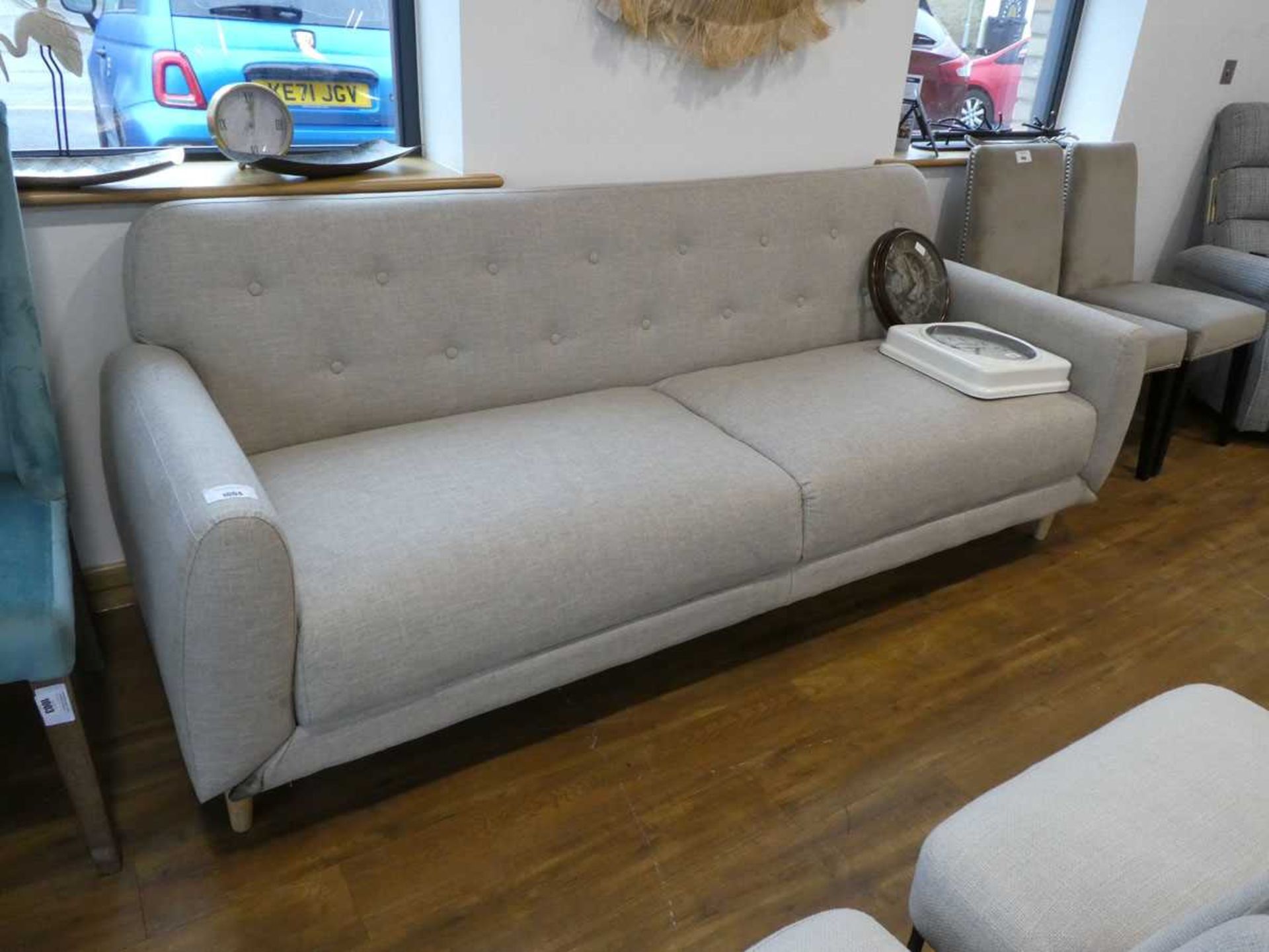 +VAT Modern light grey upholstered button studded sofa