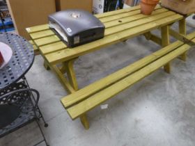 Wooden slatted picnic bench