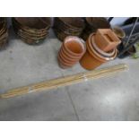 Selection of various sized plastic garden pots with 5 terracotta pots and 2 bundles of canes