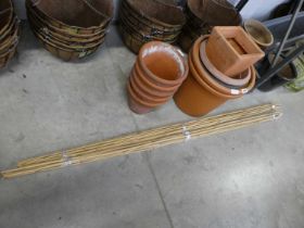 Selection of various sized plastic garden pots with 5 terracotta pots and 2 bundles of canes