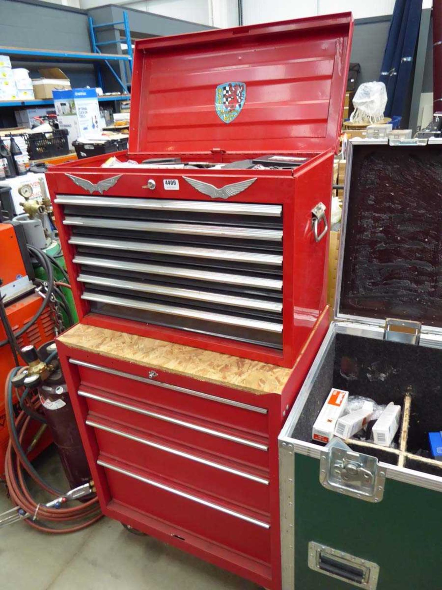 Large double drawer toolbox containing assorted tools inc., spanners, pot riveters, files, blades,