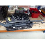 Plastic crate containing pressure washer parts