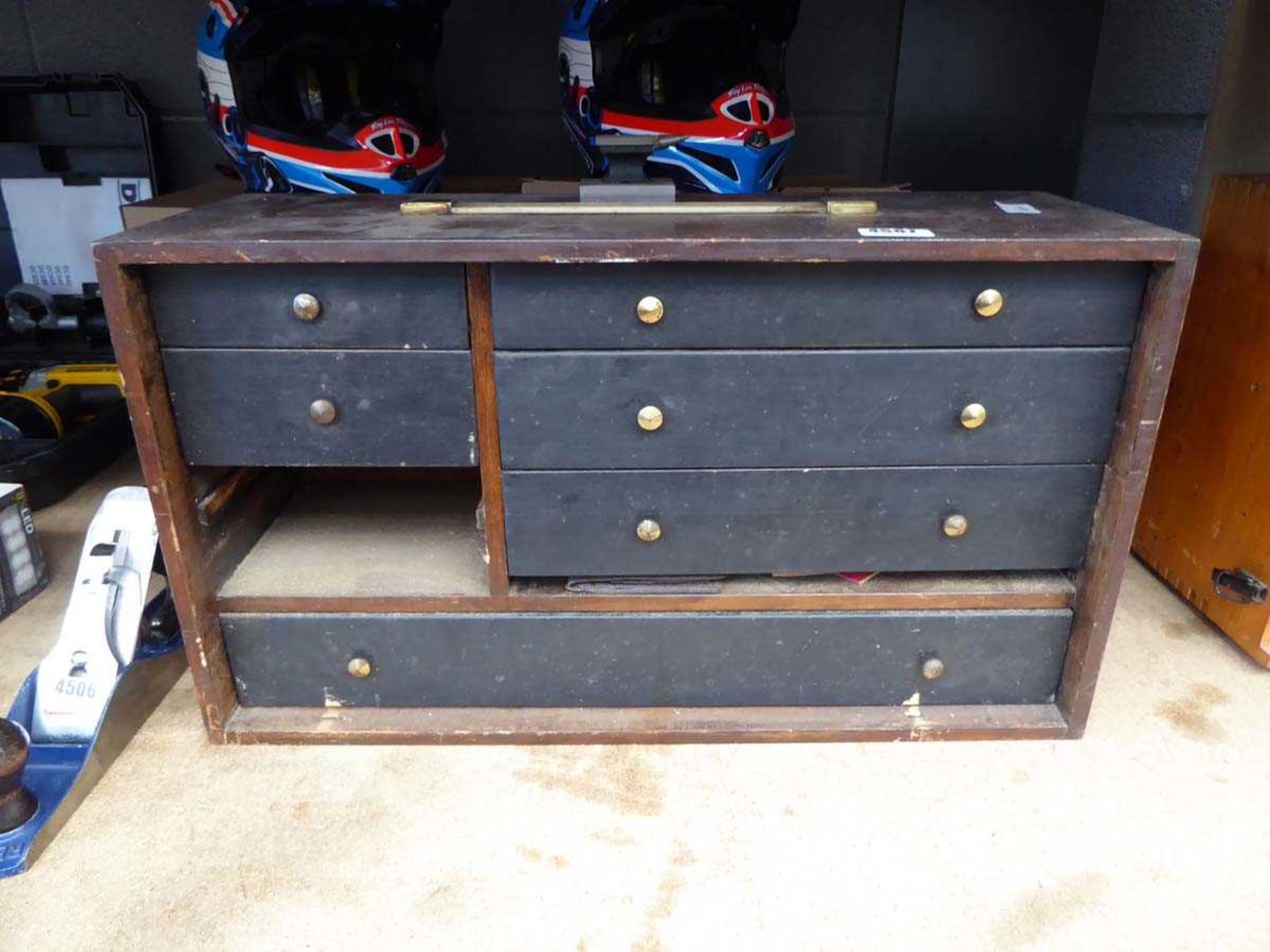 Small mini anvil and a wooden tool box containing various small tools