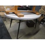 Oval faux marble dining table