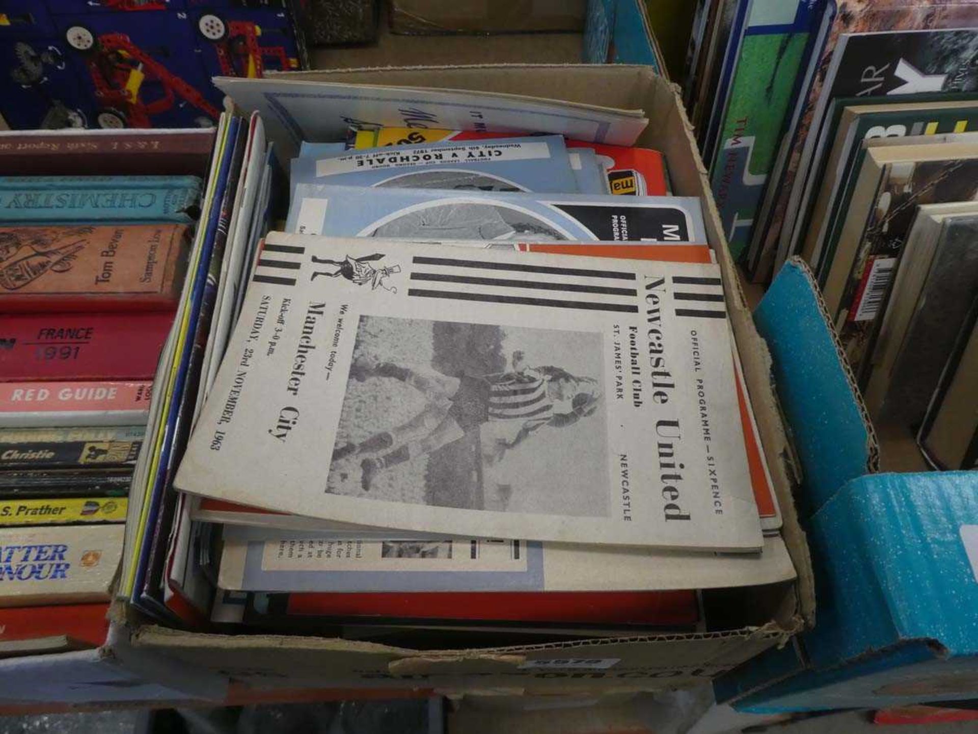 Box containing football programmes