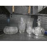 Cage containing glass bowls and pair of brandy snifters and decanter