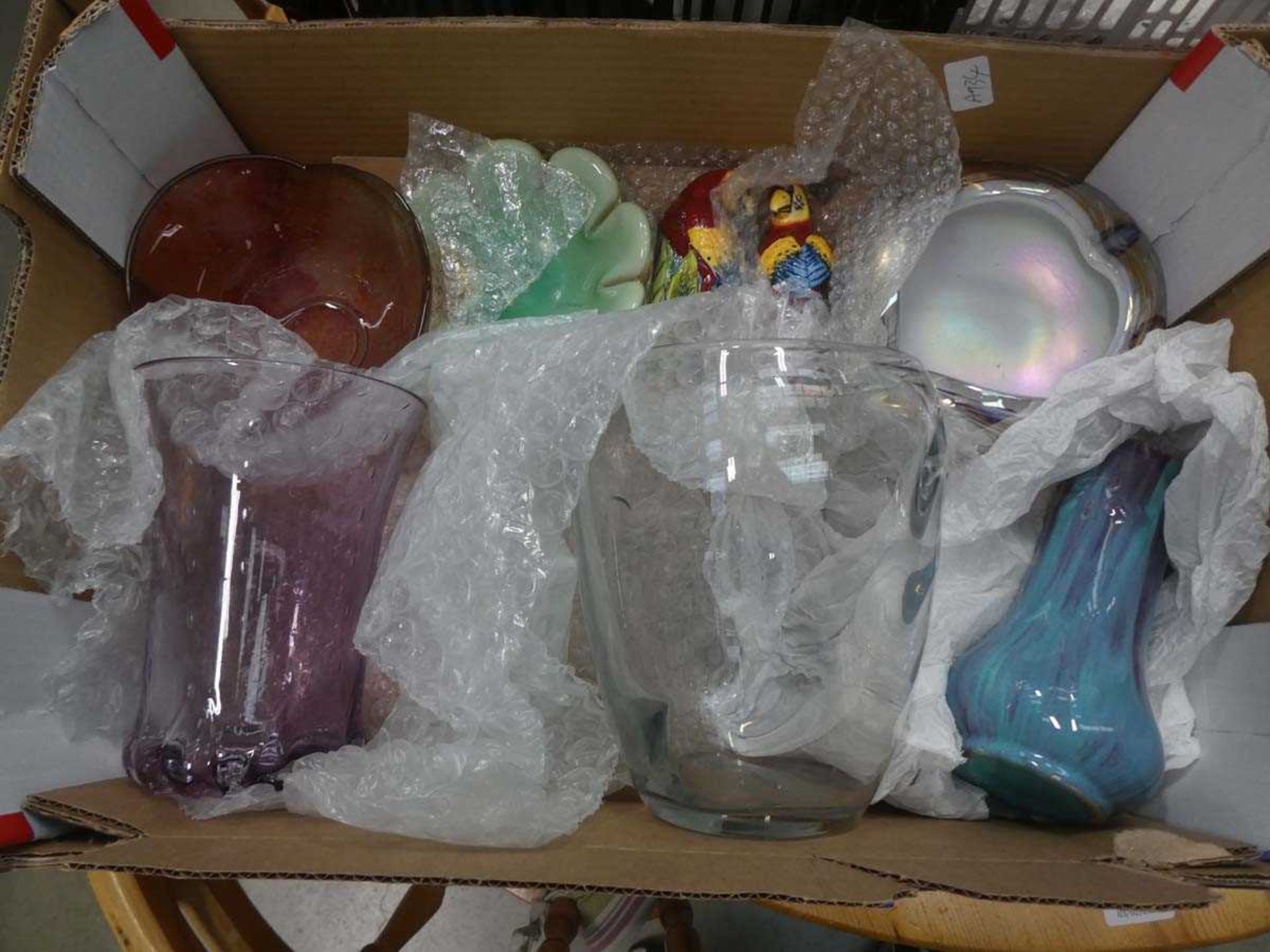 Box containing a collection of Murano style glassware plus macaw patterned salt and pepper set