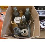 Box containing ginger beer bottles and a stilton pot