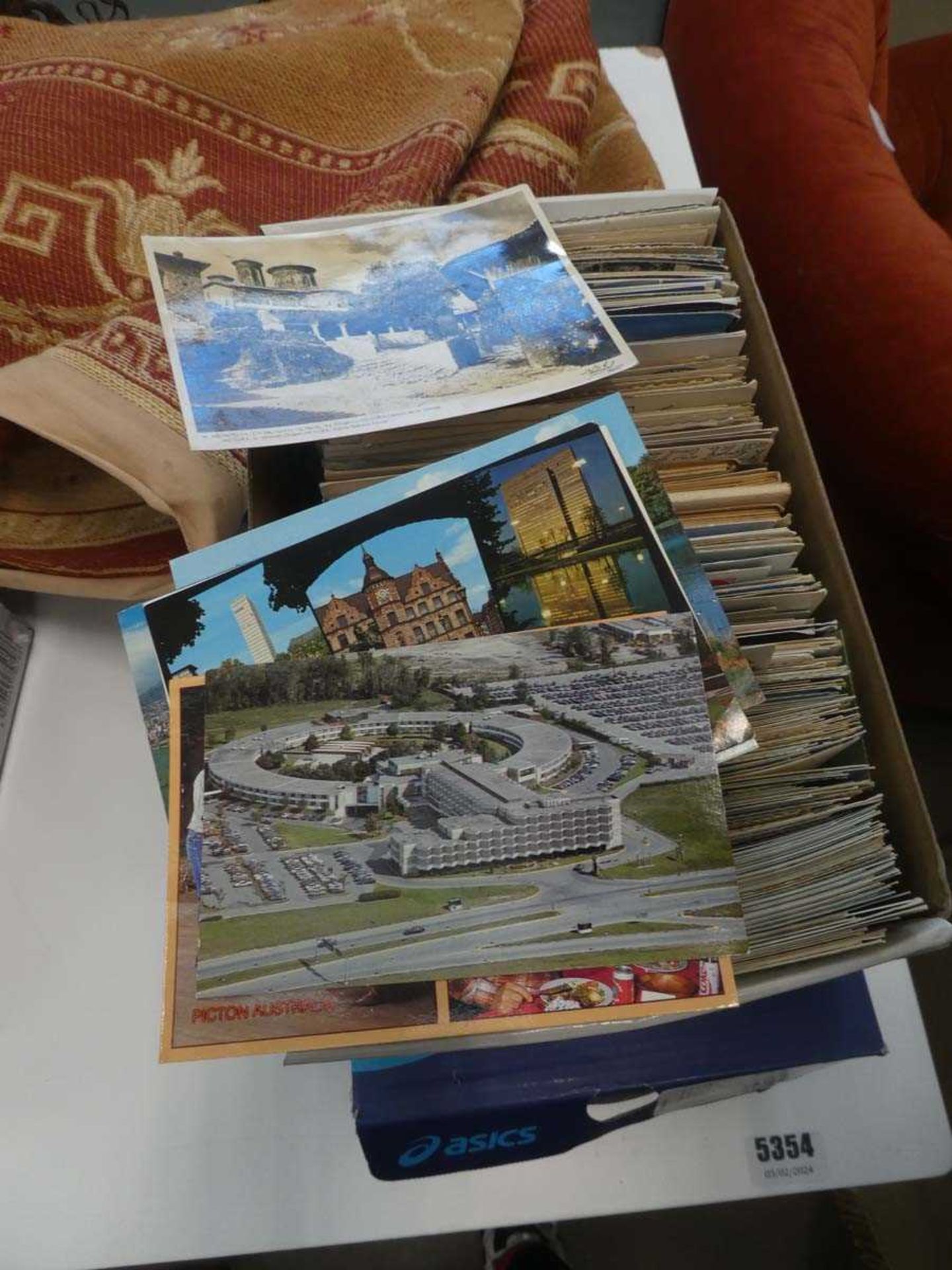 Two boxes containing postcards