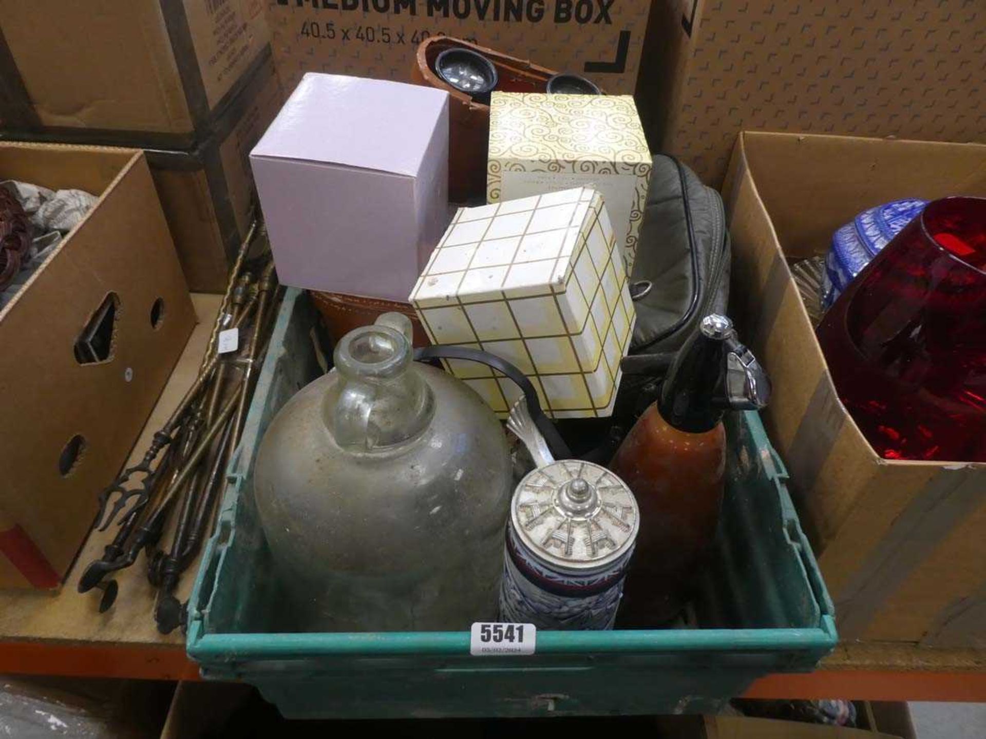 Box containing binoculars, beer stein, soda syphon and teddies