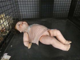 Cage containing porcelain German doll