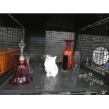 Cage containing glass knife rests, studio pottery, glass dishes, ornamental cat