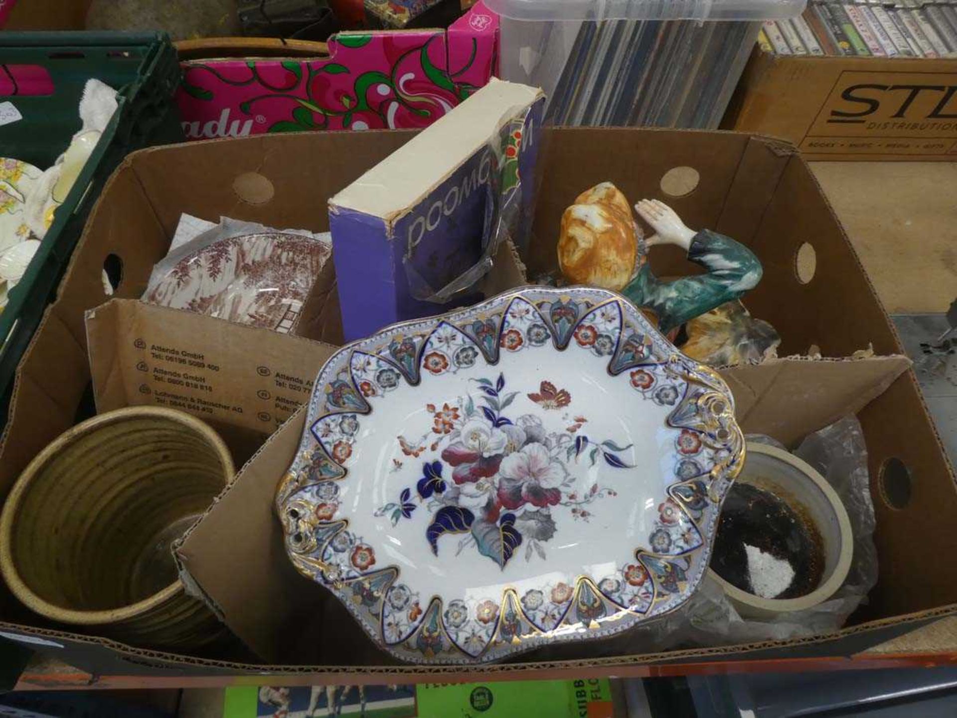 box containing floral patterned crockery plus a figure of a knife sharpener and studio pottery