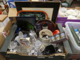 Box containing pub trays, ashtrays, pint glasses, decanters and glassware