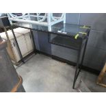 Glazed metal desk with shelf to the side