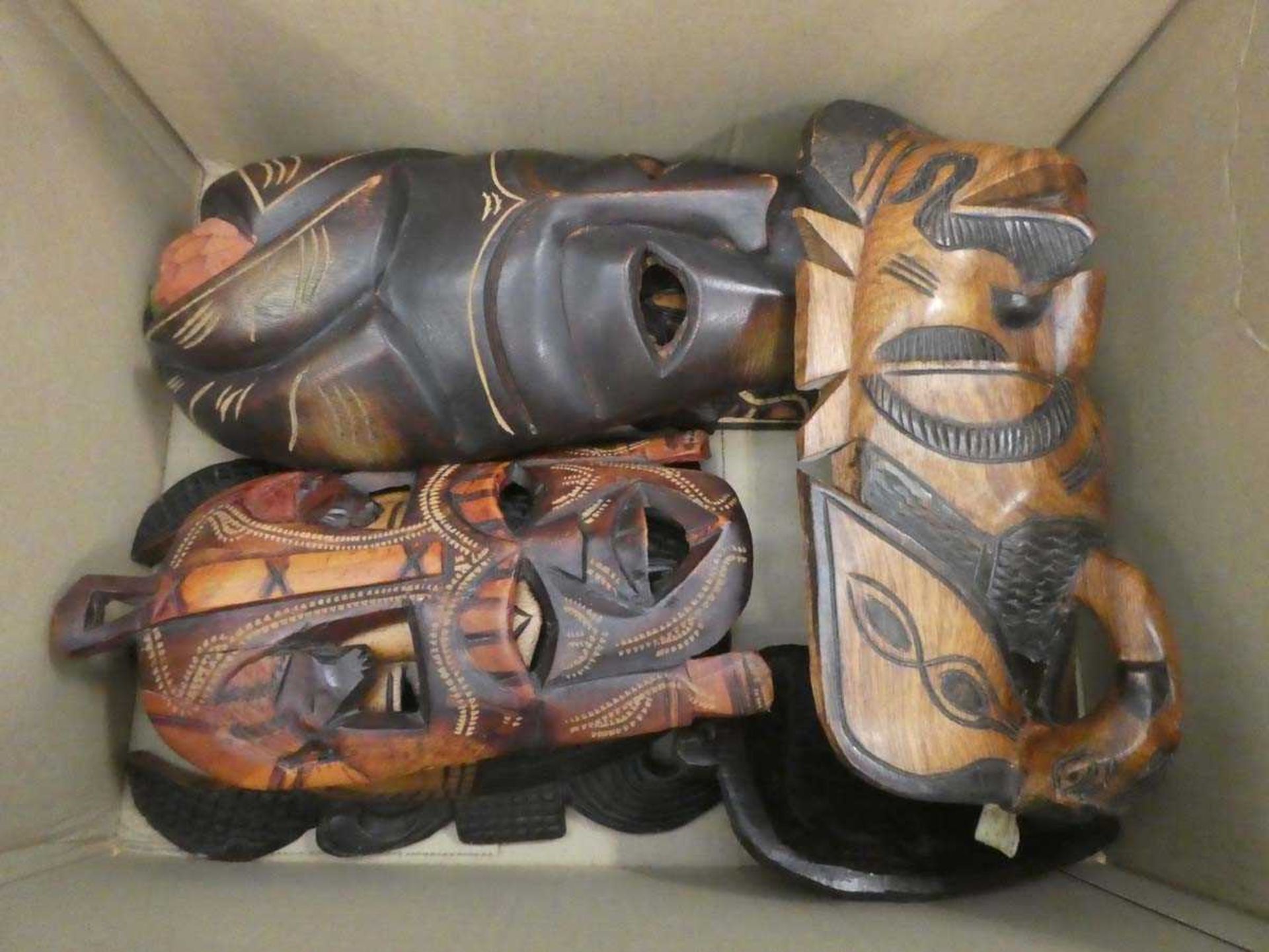 Box containing modern African masks