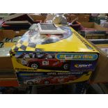 2 boxes containing Scalextric sets