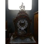 Mantle clock with ornate inlaid case