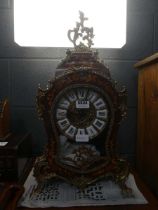 Mantle clock with ornate inlaid case