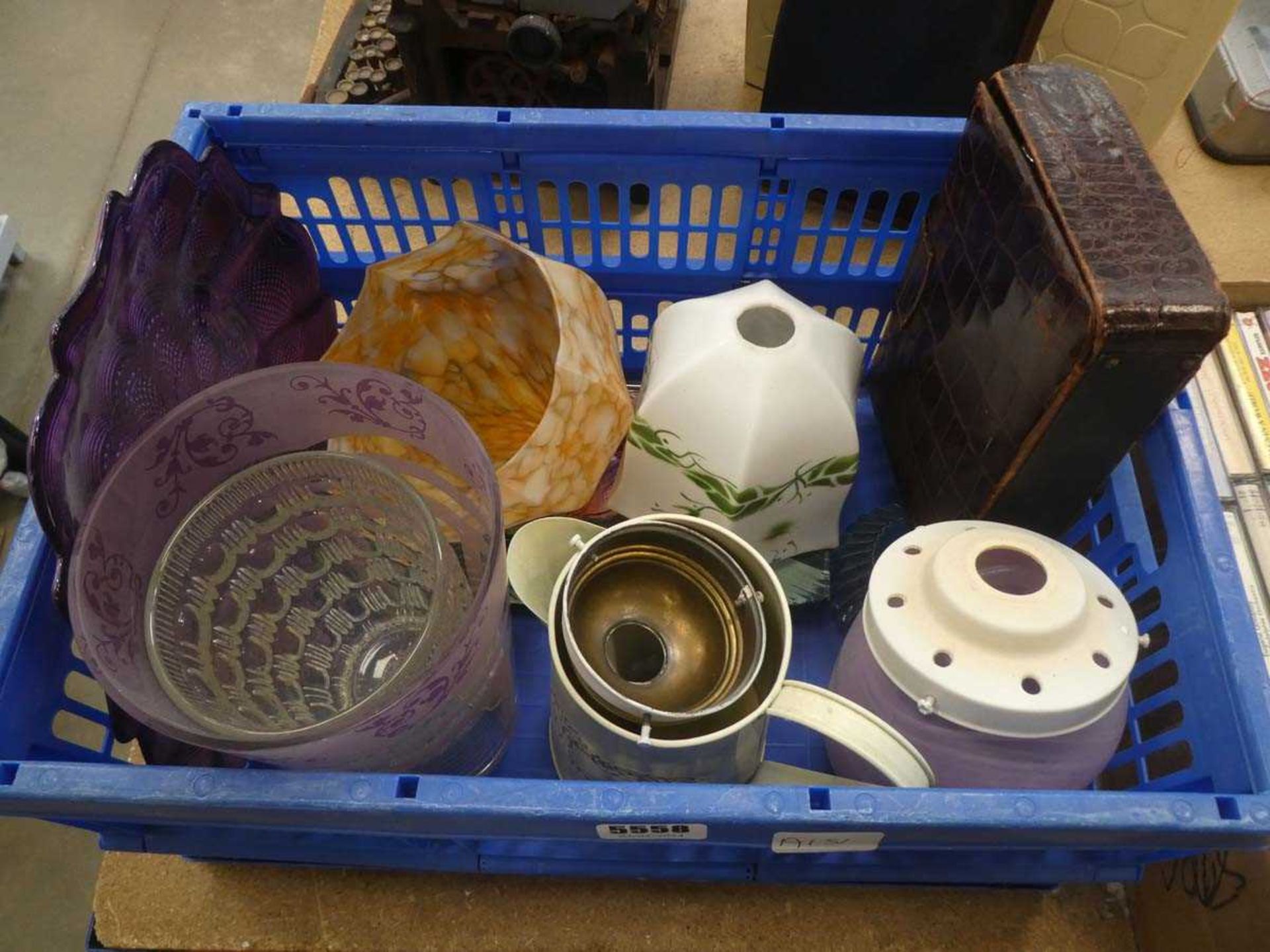 Box containing a vanity set, lampshades, tin jug and glass vases