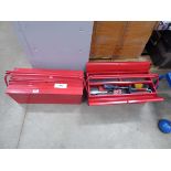 Two red cantilever metal tool boxes with various tools