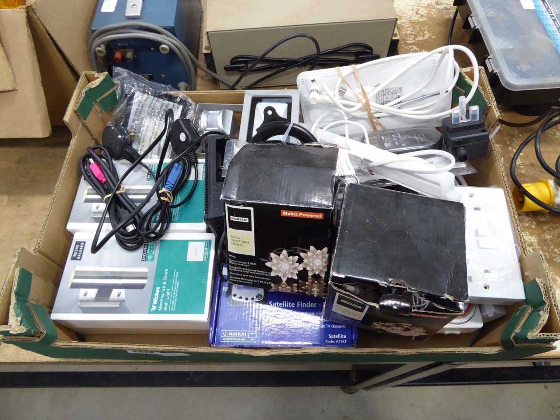 Box of electrical items including small floodlights, wall lights, chargers, electric tester, etc
