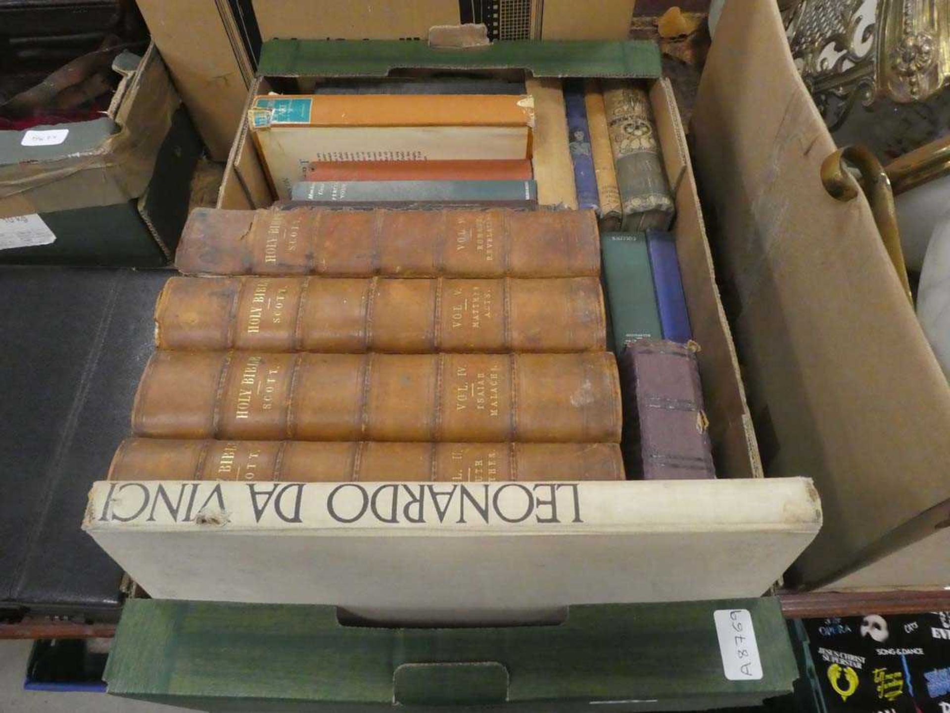 Box containing bibles, art and other reference books