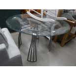 Circular glazed dining table on metal base