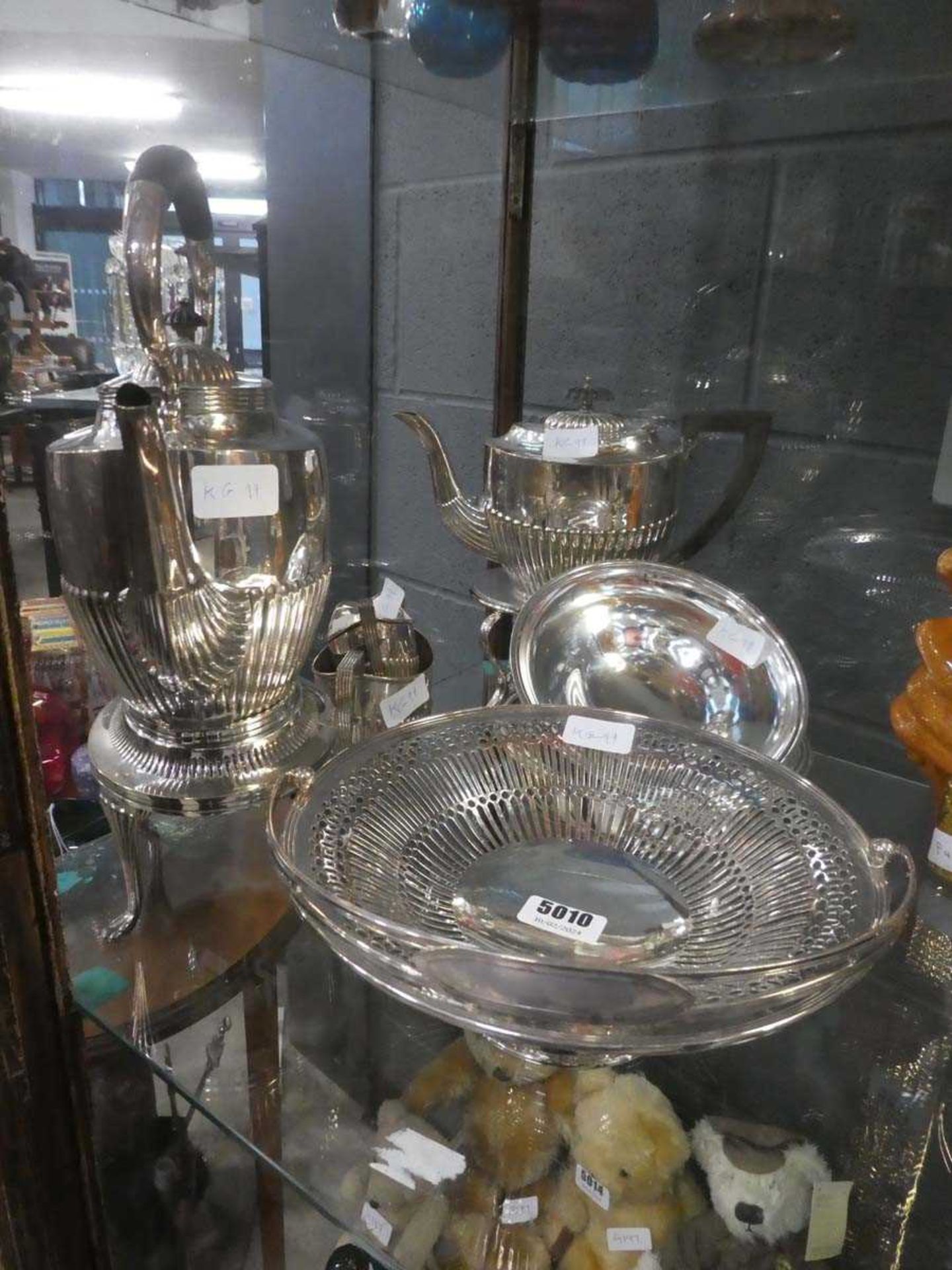 Collection of silver plate to include two teapots with stands, milk jugs and a cake basket