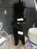 Startled black cat