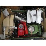 Box containing collection of rotary and other vintage telephones