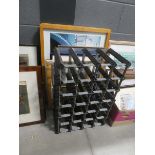 Wine rack plus picture frames, mirror and print of a villa