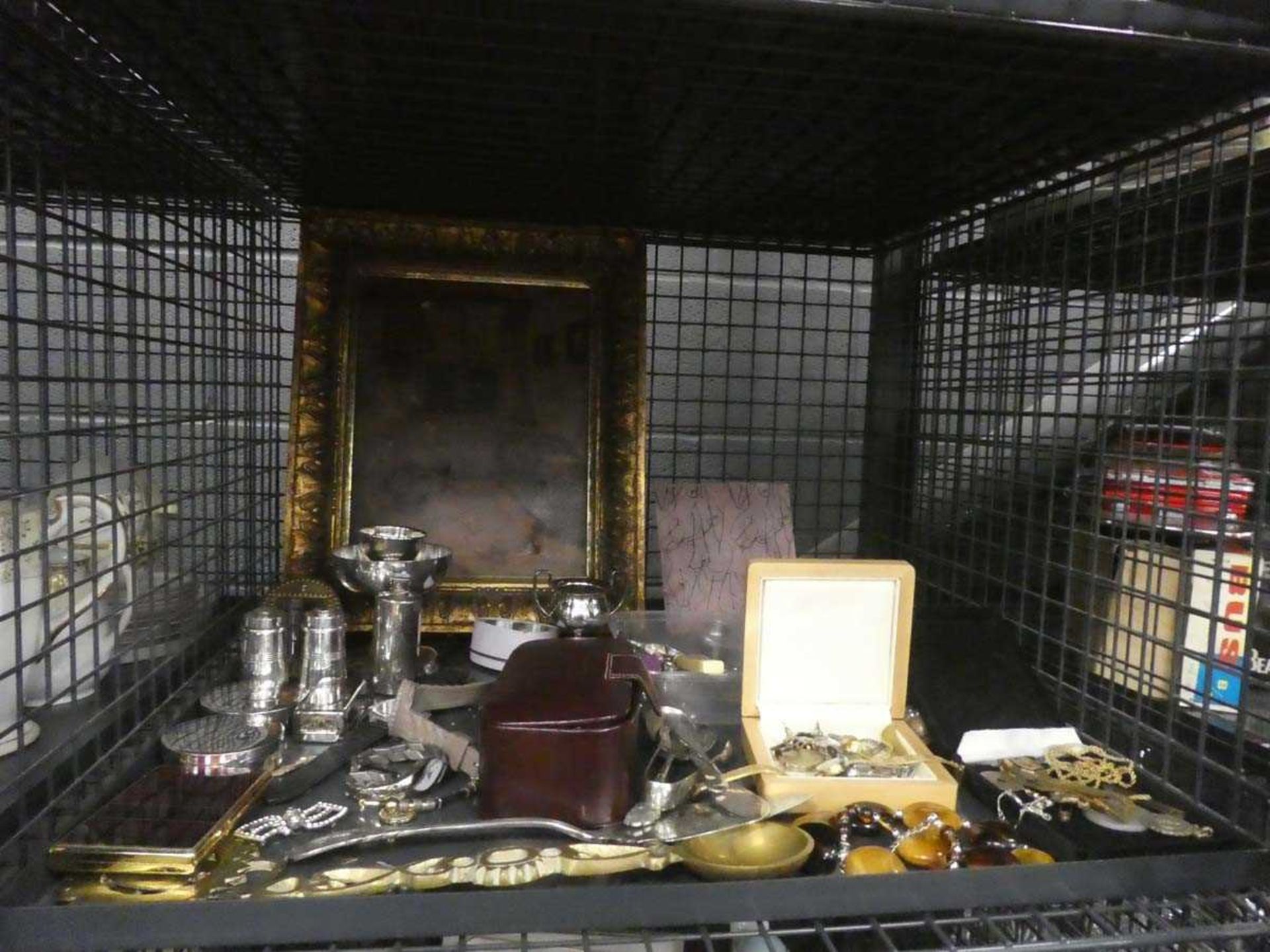 Cage containing brass Welsh loving spoon, small painting, costume jewellery, salt and pepper set and