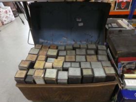 Tin trunk with quantity of piano rolls
