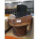 Leather hat box and silk hat