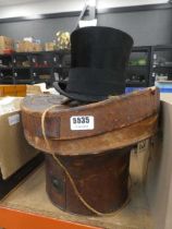 Leather hat box and silk hat