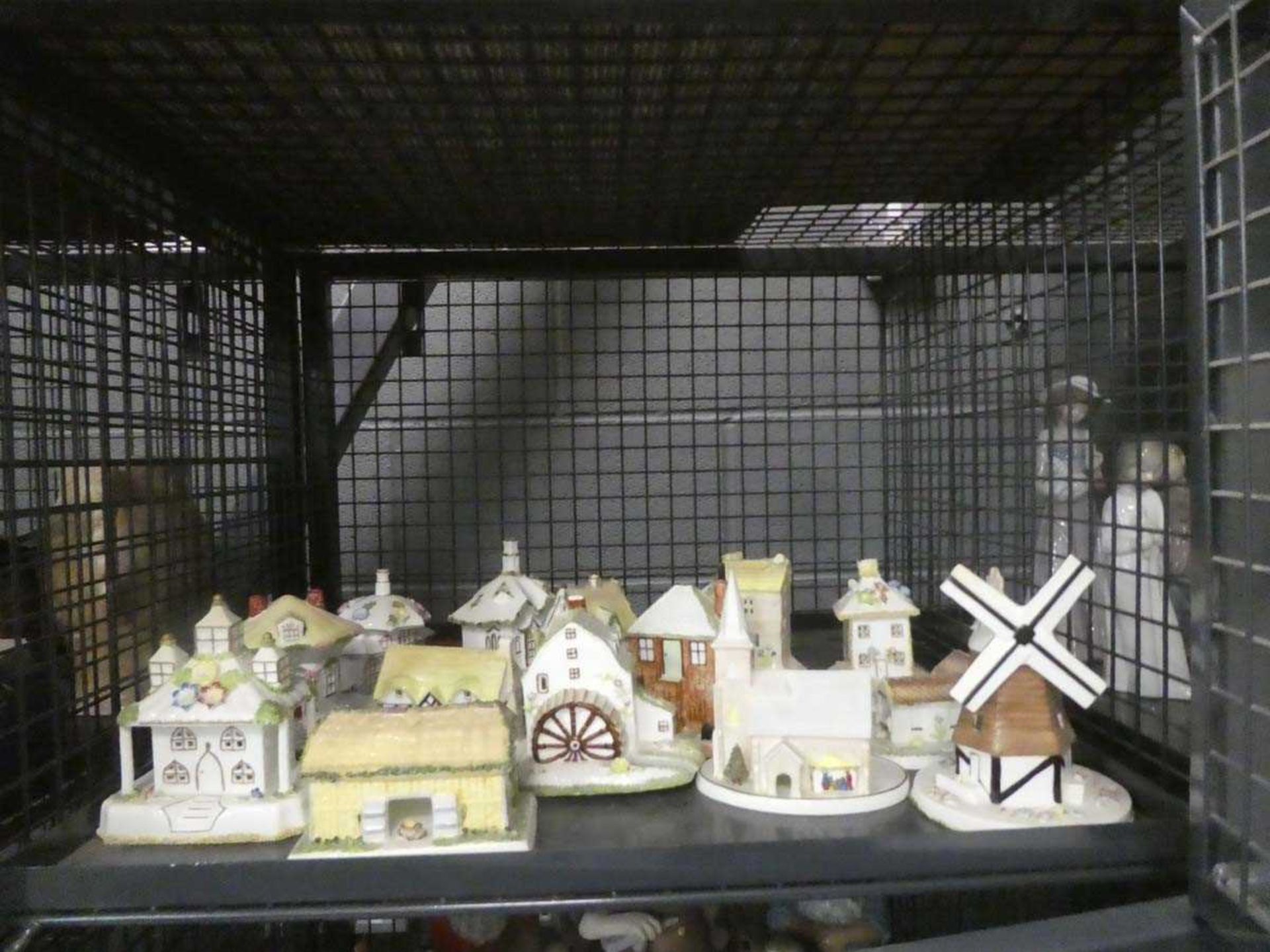 Cage containing Coalport ornamental cottages and churches