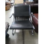 Chromed and black leather effect airport style seat